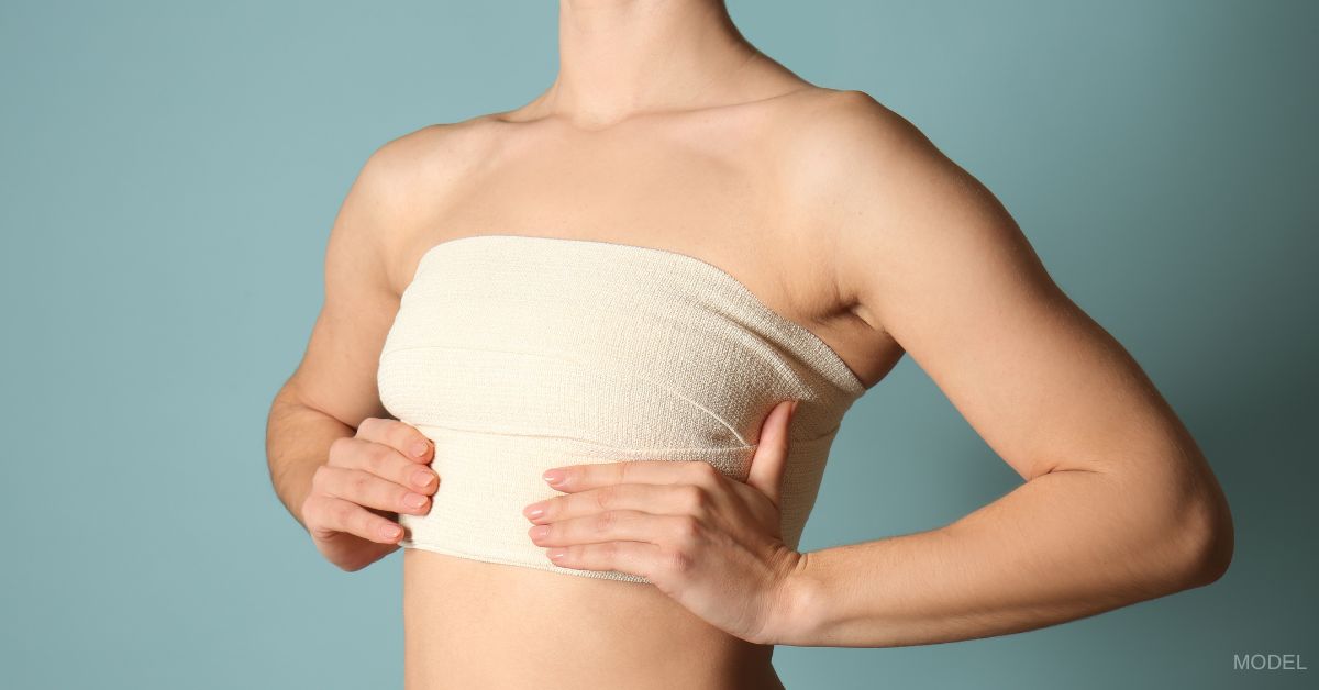 A woman with a bandage wrapped around her chest. (Model)